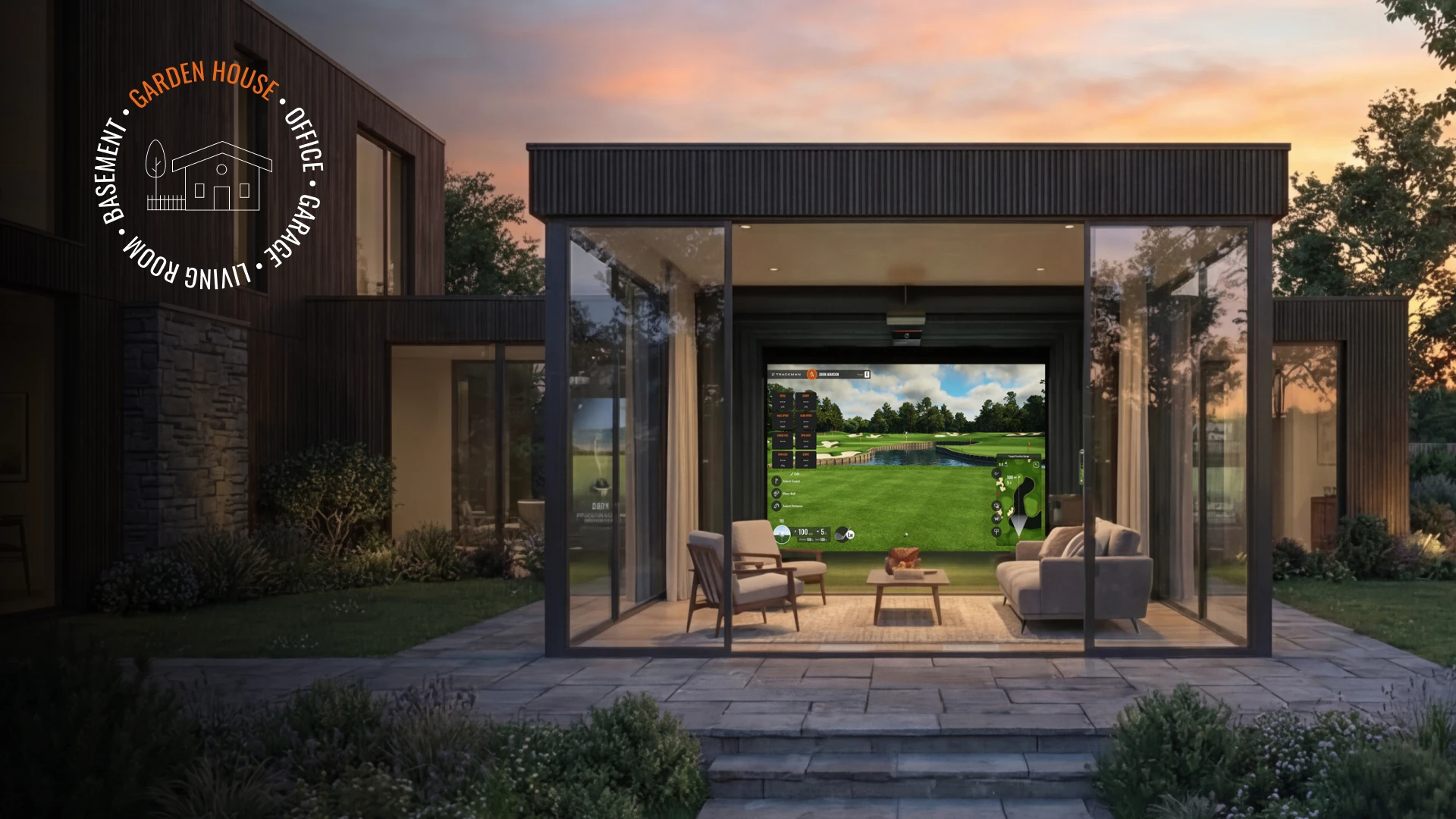 Modern glass garden house with an interior golf simulator and cozy seating, surrounded by lush greenery at sunset.