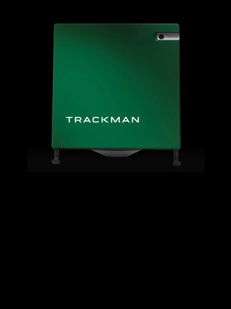 Green Trackman device with a small camera on the top right, set against a black background.